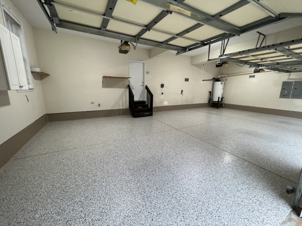 decorative flake epoxy garage floor with uniform finish installed for residential garage use