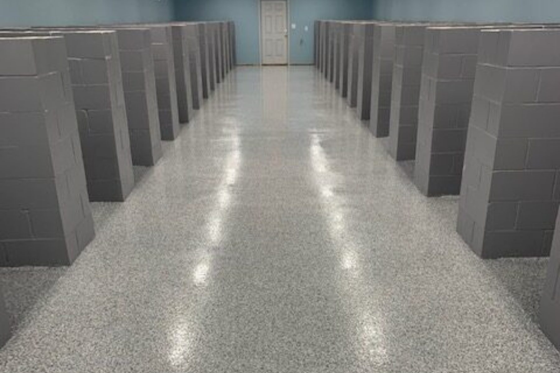 commercial epoxy floor with light gray flake finish inside animal shelter corridor