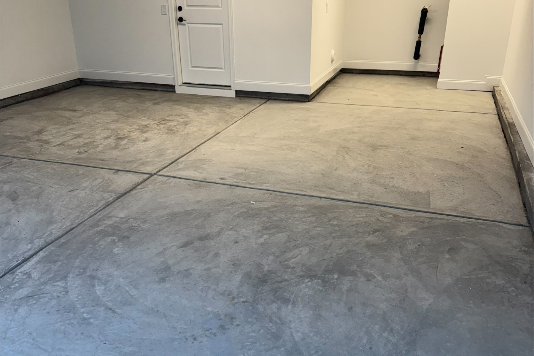 bare concrete garage floor before epoxy installation and surface prep
