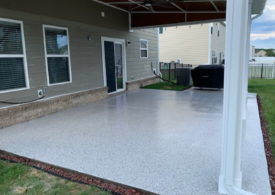 Covered Backyard Porch Epoxy Floor Installation With Shoreline Gray Flake
