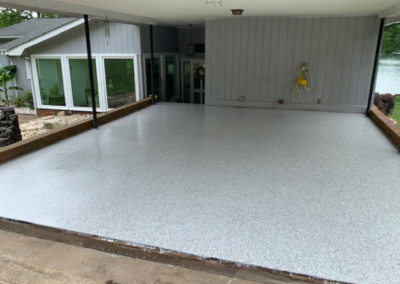 Covered Lakeside Carport Epoxy Floor Installation With Pearl Gray Flake