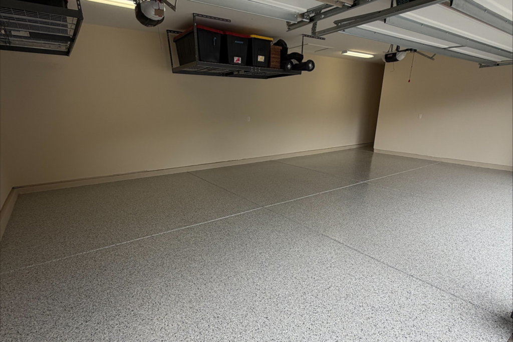 residential garage with glacier gray flake epoxy floor coating and sealed concrete surface