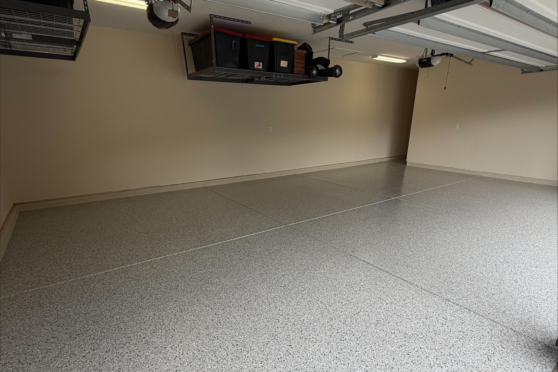 residential garage with glacier gray flake epoxy floor coating and sealed concrete surface